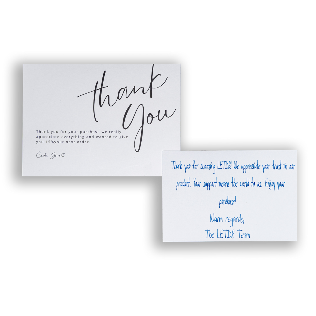 A white and black thank you note, with a neatly written message on it. 