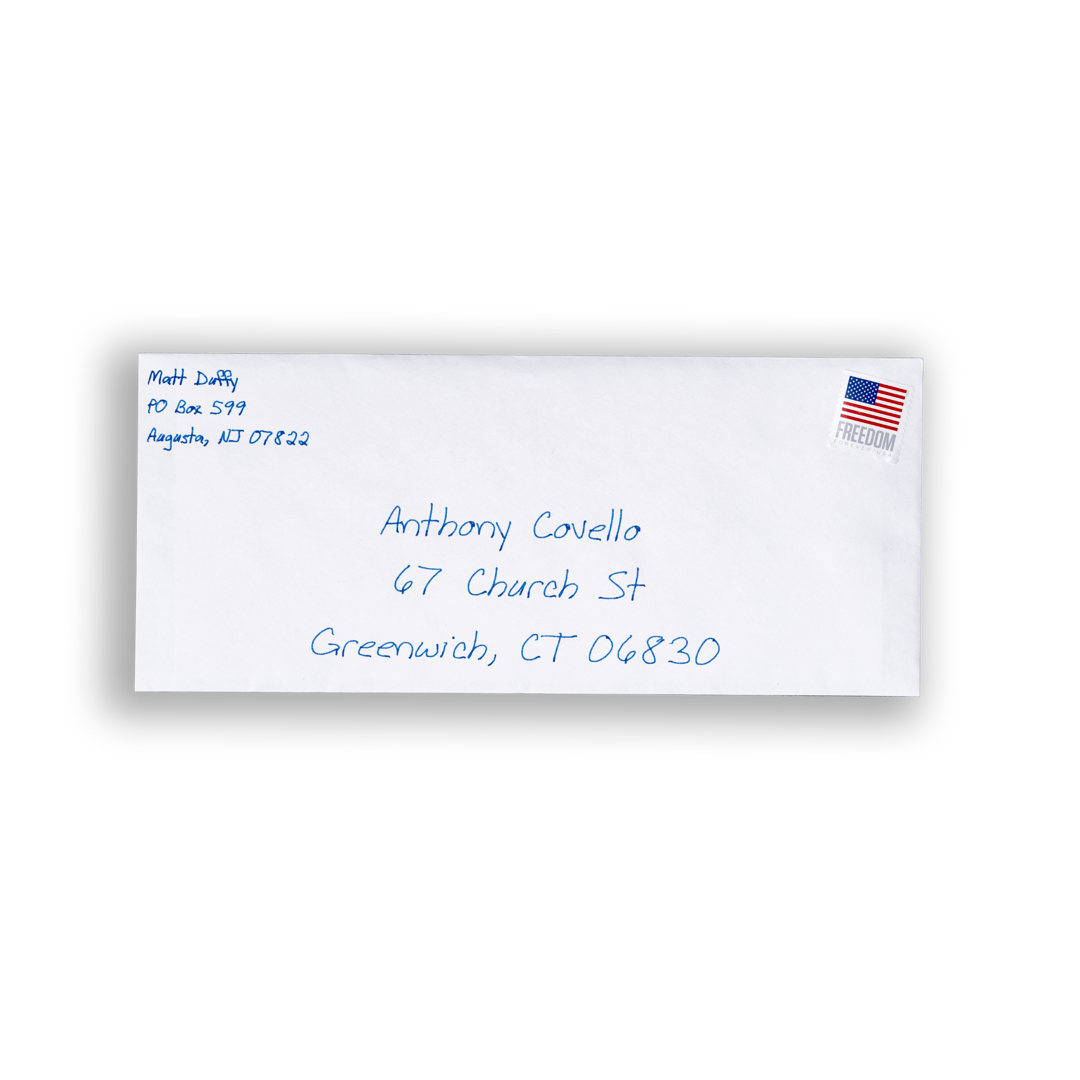 A white #10 envelope, with the addresses inked in blue pen. 