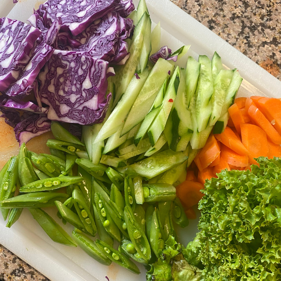 Red cabbage, snap peas, cucumber, carrot, lettuce for bibimguksu