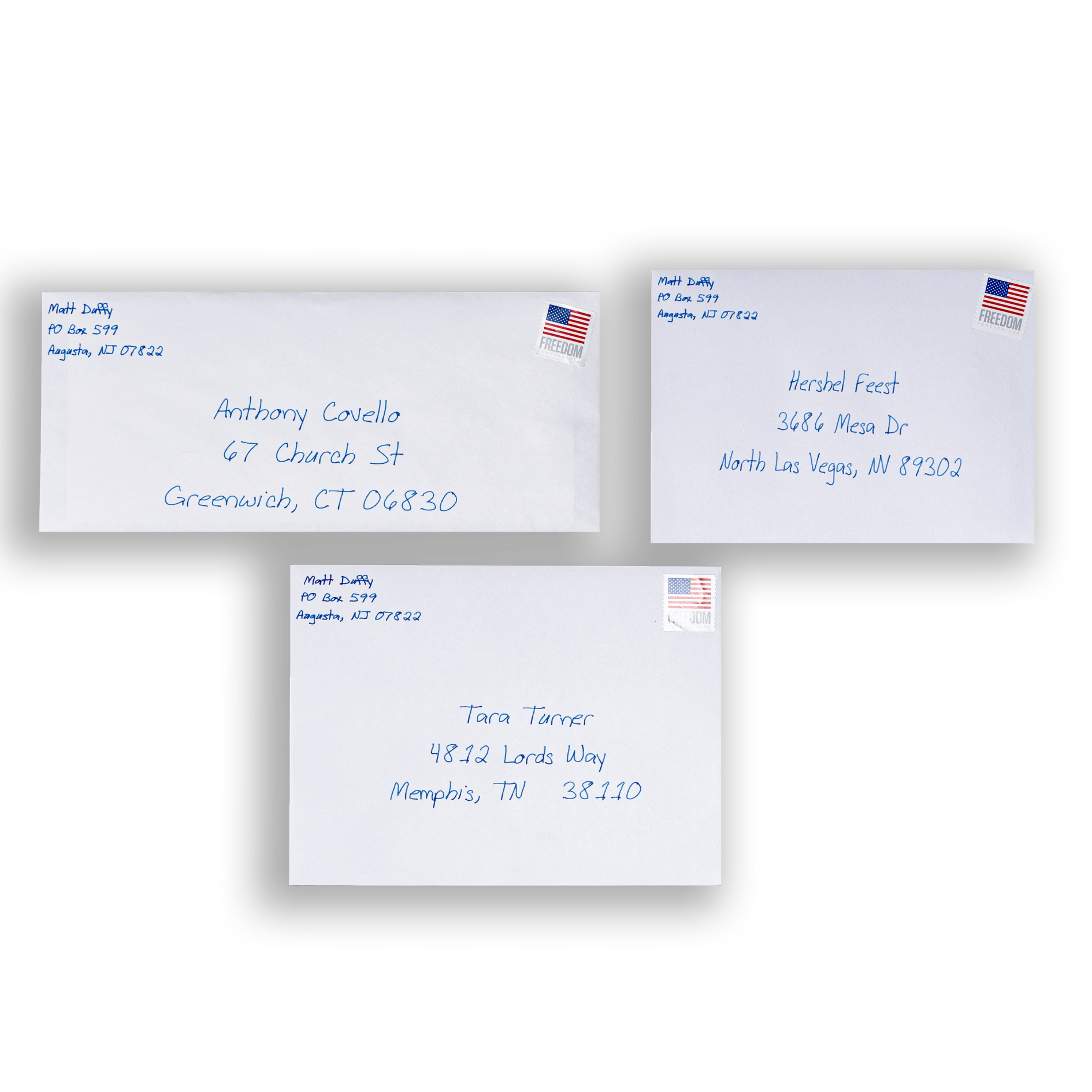 Three envelopes with writing and a stamp, ready to be sent.