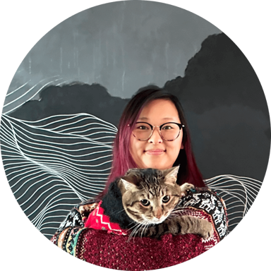A picture of Ellen, a Coverage Cat customer, holding a cat in front of a wave patterned blue background.
