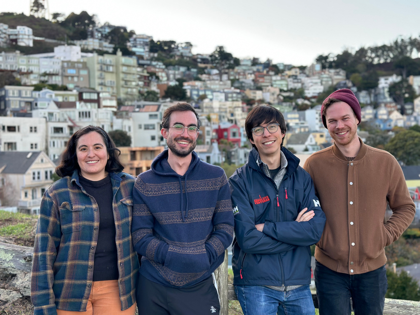 The Coverage Cat team smiles and poses for a picture on Kite Hill in San Francisco.